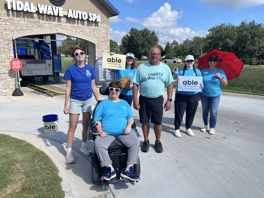 Able SC staff pose outside with Tidal Wave staff.