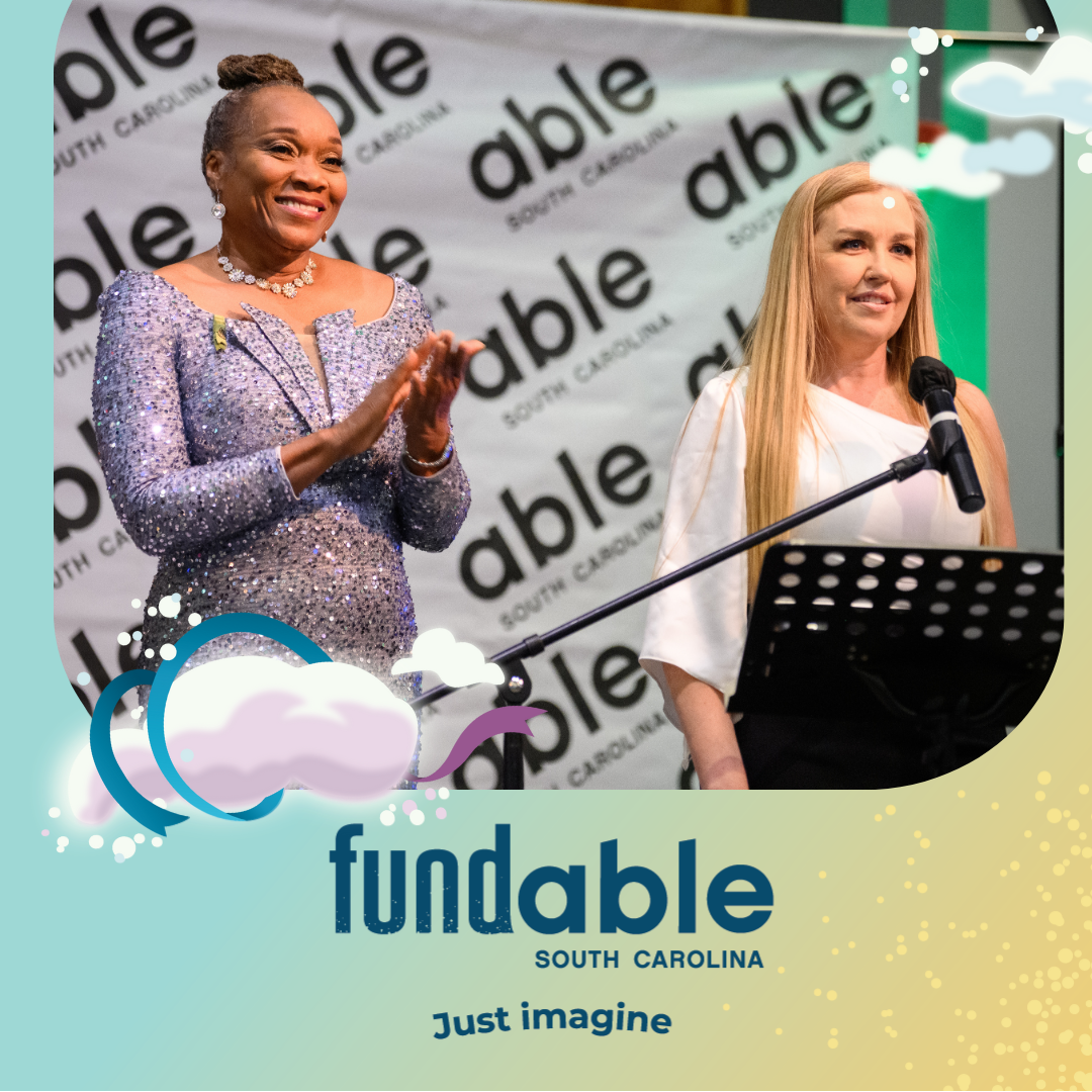 Photo of a senior Black woman in a blue sequin dress clapping while accepting an award from Mandy, an Able SC staffer. Mandy is a white woman with long blonde hair.