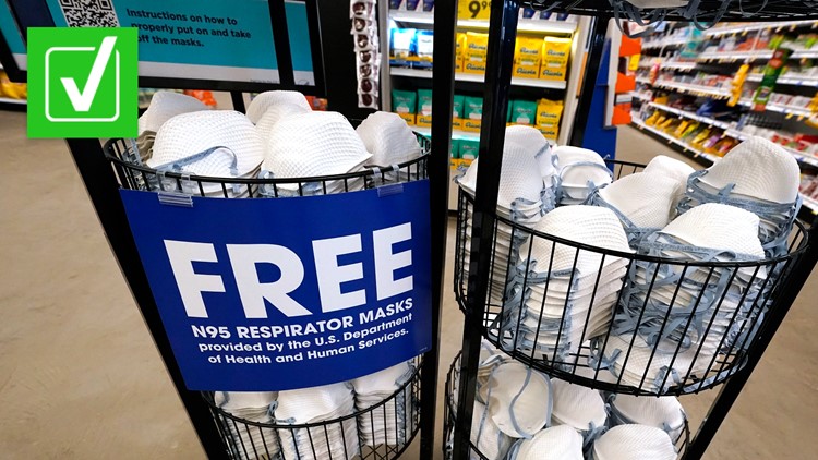Photo of free N95 masks in a basket in a store. Sign reads, 'Free N95 respirator masks provided by the US department of Health and Human Services.