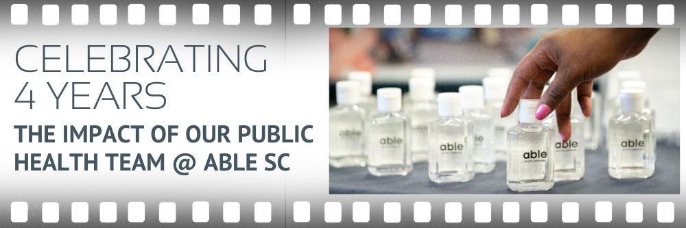 Graphic with image of a hand of a Black woman arranging mini hand sanitizers with able sc logo. Text reads, 'Celebrating 4 years, the impact of our public health team at Able SC.'